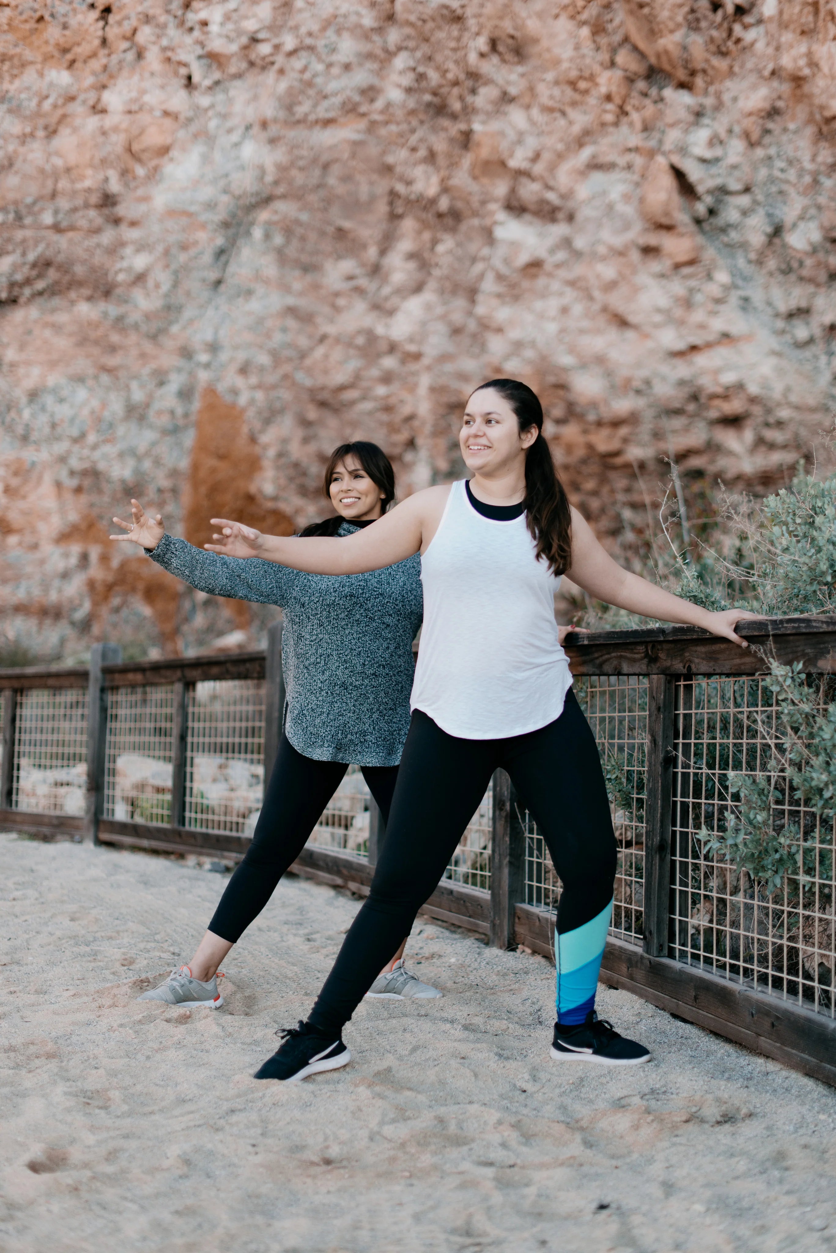 files/two-women-strike-a-yoga-pose-on-the-beach.webp